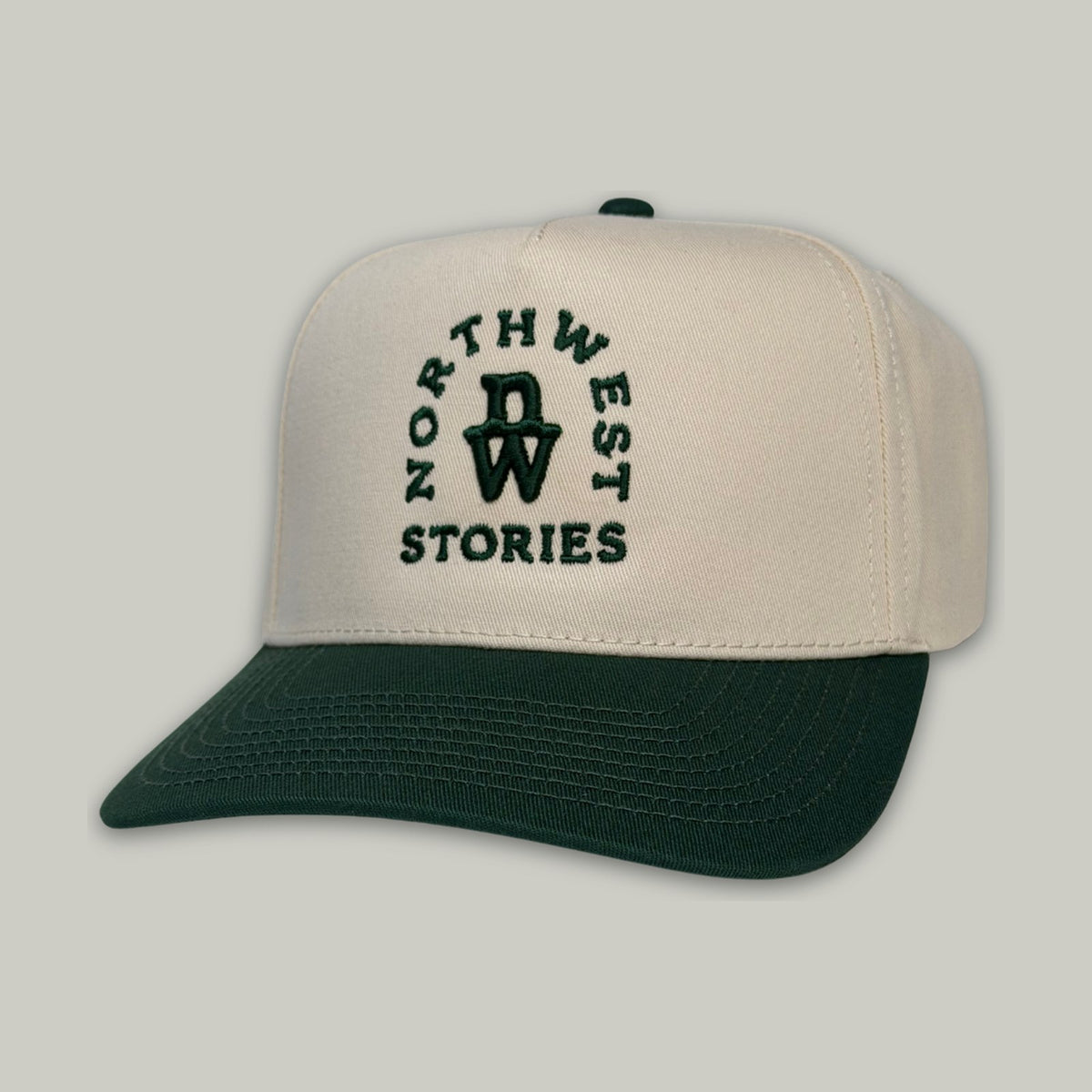Northwest Stories Champ hat in cream and green, front